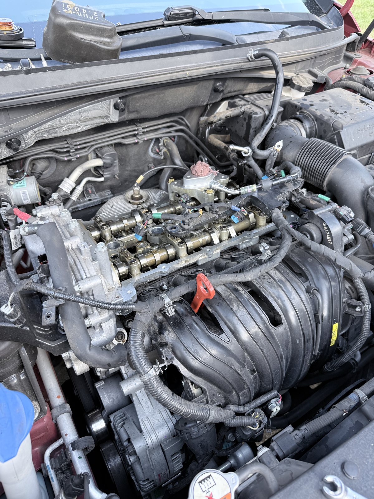 Close-up of automotive engine repair work in progress